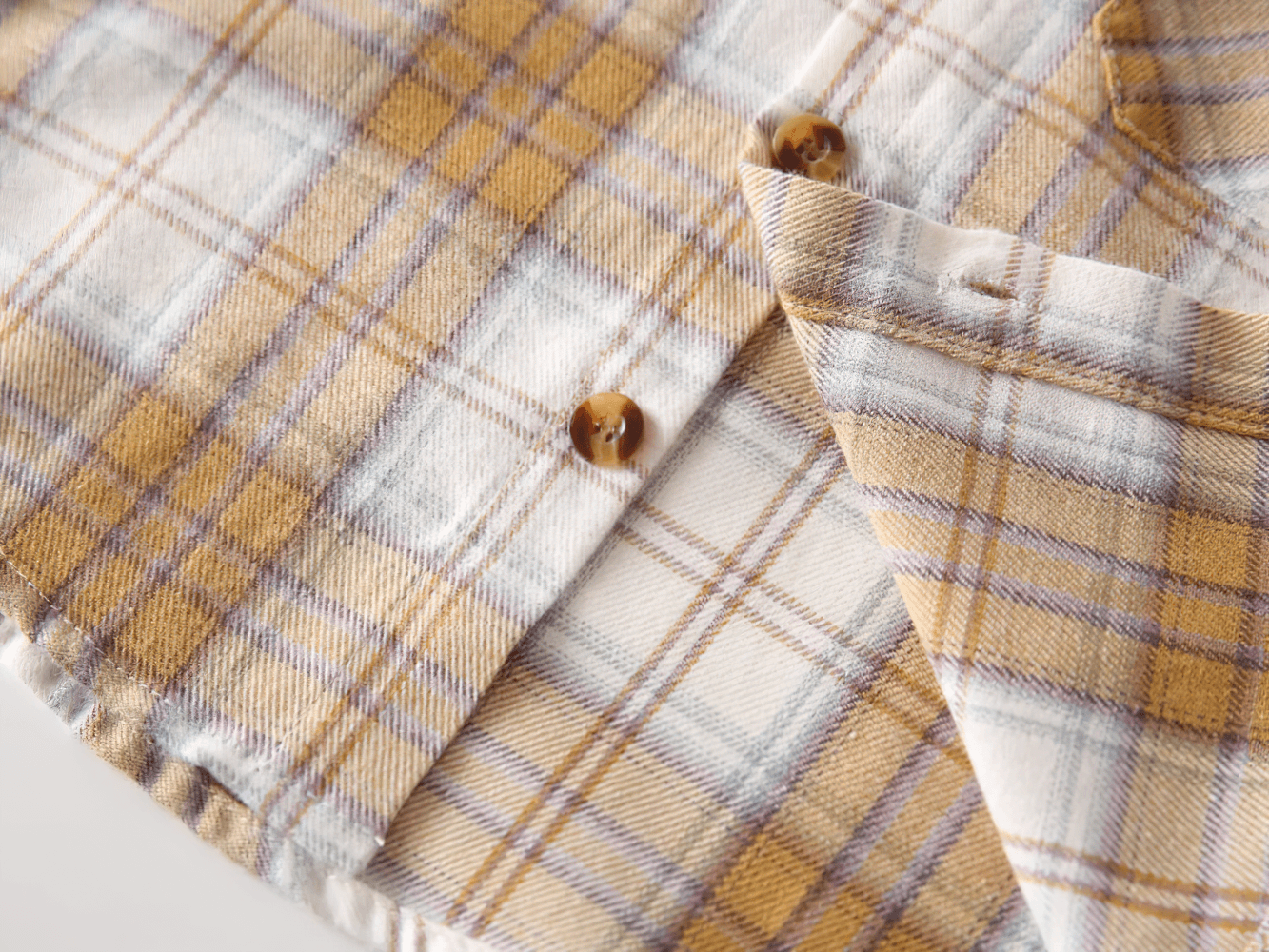 Close-up of Plaid Long-Sleeved Toddler Boys Flannel Shirt - SF3521 showing soft fabric and button detail.